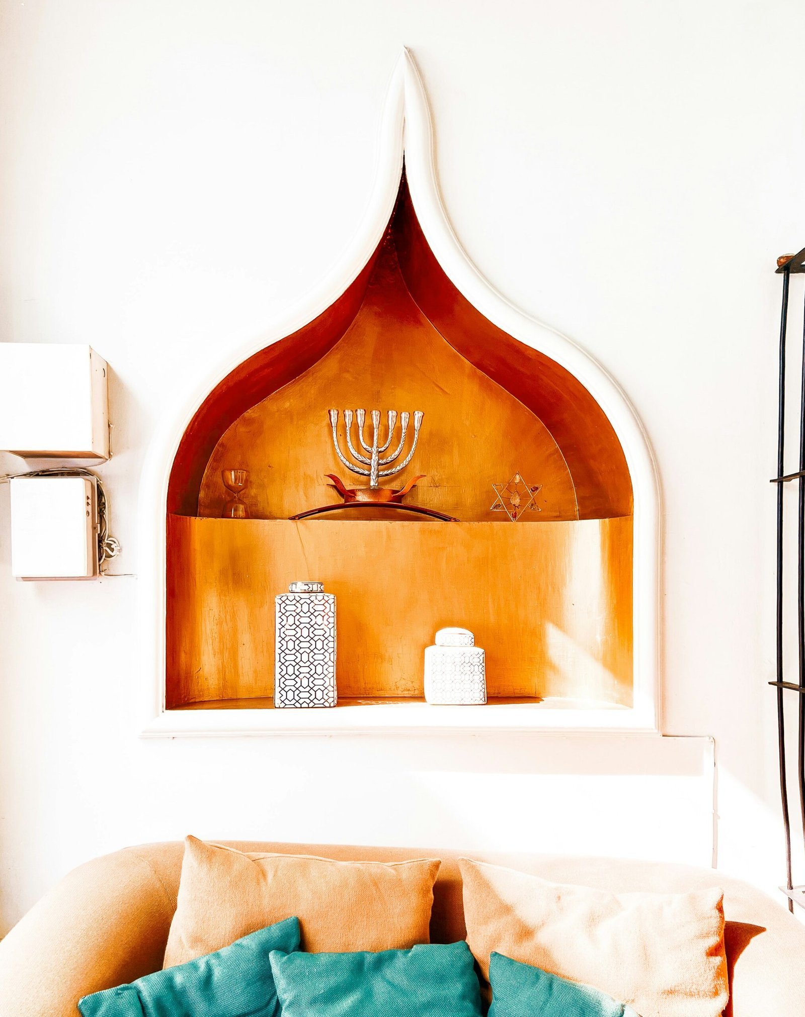 a living room with a couch and a shelf